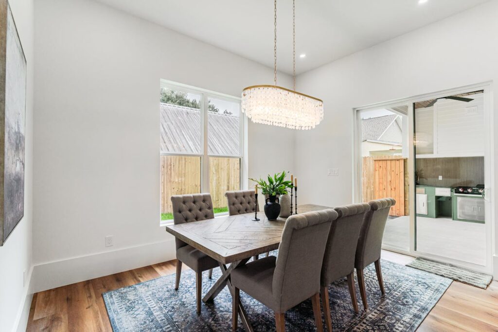 Modern dining area with elegant decor and natural light, perfect for luxury real estate listings.